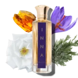 Bellke kin Inna parfum fles met paarse opdruk en gouden accenten. Achter parfum fles ge geurnoten getoond